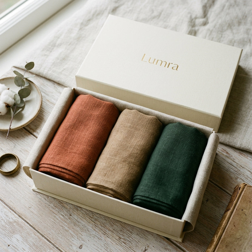 An open Lumra box with three coordinated Anchor, Neutral, and Accent scarves